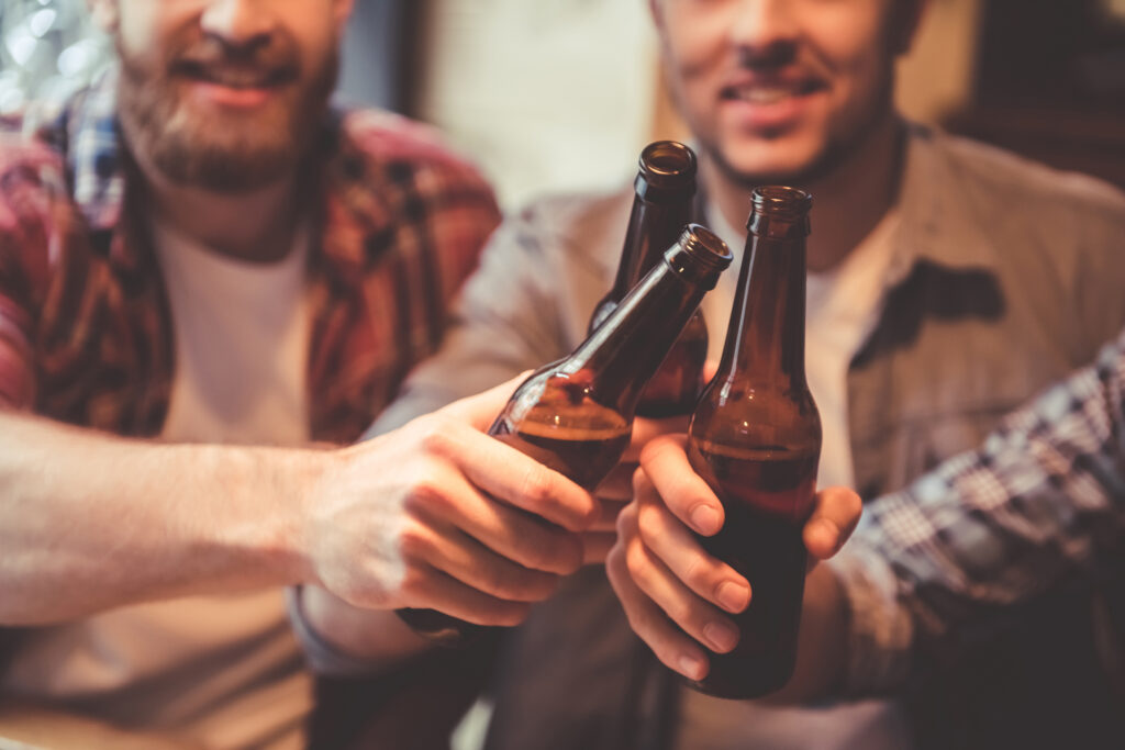 Men drinking beer and laughing